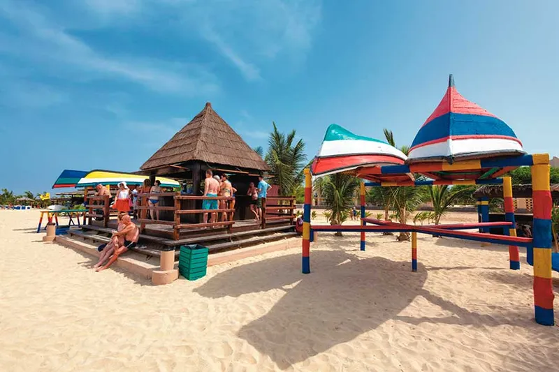 Freshwater pool and palm-lined grounds at Hotel Riu Funana, a 24-hour all inclusive resort in Cape Verde